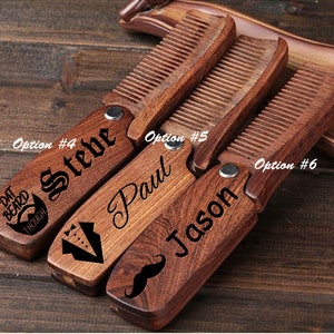 May include: Three wooden pocket combs with personalized engravings. The combs are brown with a dark wood grain. The first comb has the text "DAT BEARD THOUGH" and "Steve" engraved on it. The second comb has the text "Paul" engraved on it. The third comb has the text "Jason" and a mustache engraved on it.