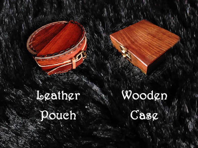 May include: Two different storage options for small items. A round, brown leather pouch with a flap and a rectangular wooden box with a brass latch. The text "Leather Pouch" and "Wooden Case" is printed below each item.