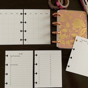 May include: A set of six blank printable planner pages with a gold and pink floral design. The pages include a monthly calendar, a daily planner, a to-do list, and a budget tracker.