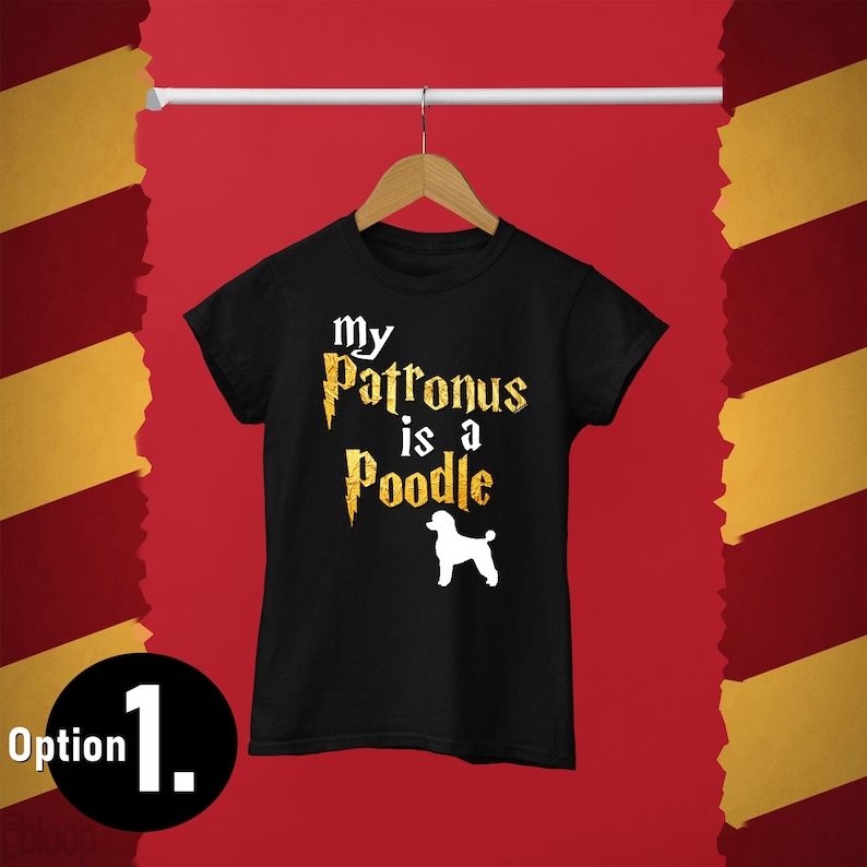 May include: Black t-shirt with a gold graphic that says "My Patronus is a Poodle" with a lightning bolt and a white silhouette of a poodle.