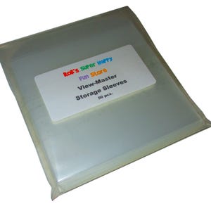 May include: A package of 50 clear plastic sleeves for storing View-Master reels. The package has a label that says "Bob's Super Happy Fun Store View-Master Storage Sleeves 50 pcs."
