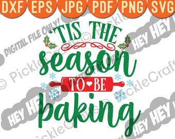 May include: Green text on a white background reads "Tis the season to be baking" with a red rolling pin with a white heart in the middle.  Snowflakes are scattered around the text.
