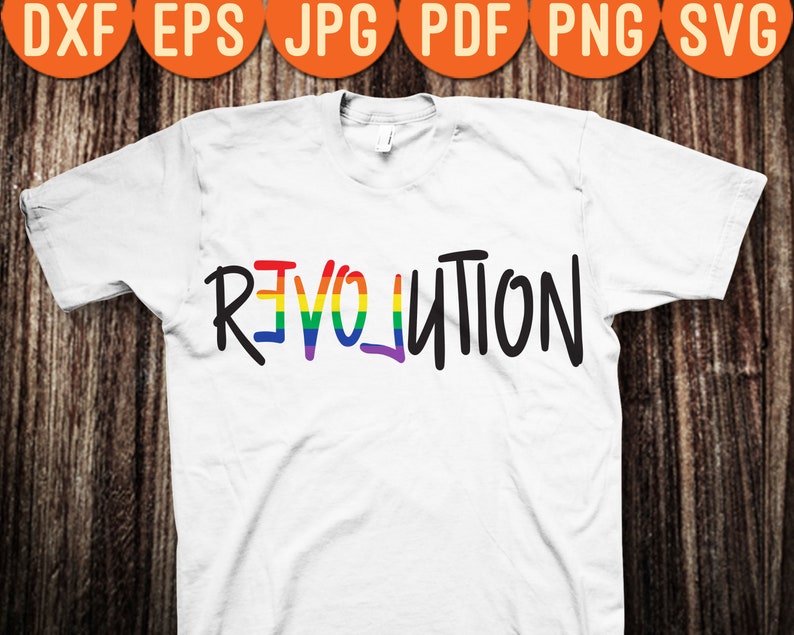 May include: White t-shirt with the word "REVOLUTION" written in black with a rainbow stripe through the "E" and "O".