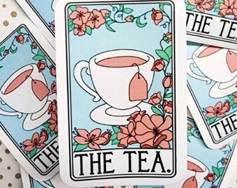 May include: A set of colorful stickers featuring a teacup and teapot with the text "THE TEA." The stickers have a blue background with pink flowers and green leaves.