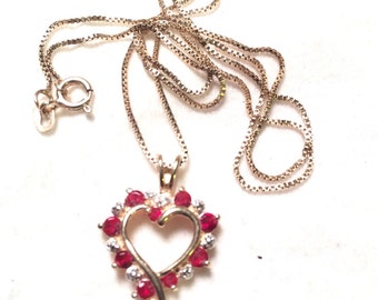 Gold over 925 sterling silver heart with red gem / stone