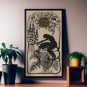 May include: A framed black and white art print featuring a silhouette of a woman pouring water from a vessel. The artwork has an Art Nouveau style with floral and botanical elements. The print is displayed on a wall with potted plants.