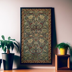 May include: A framed tapestry with a floral design in shades of red, green, blue, and cream. The tapestry features a repeating pattern of stylized flowers and leaves.