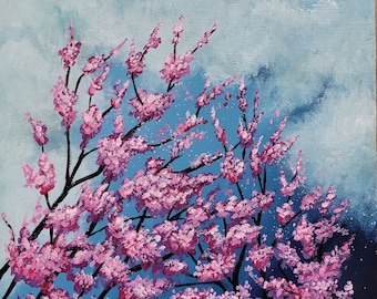 Könnte beinhalten: Ein Gemälde eines rosa Kirschbaums vor einem blauen Himmel mit weißen Wolken. Der Baum steht in voller Blüte und die Blüten sind in einem leuchtenden Rosa gehalten. Der Himmel ist hellblau und die Wolken sind weiß und flauschig.