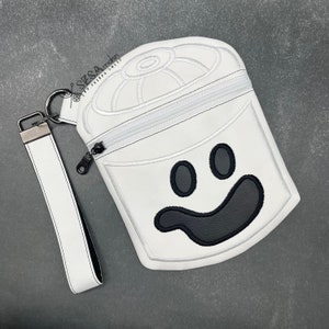 May include: White zippered pouch with a black smiling ghost face embroidered on the front. The pouch has a white strap with a silver metal clasp.