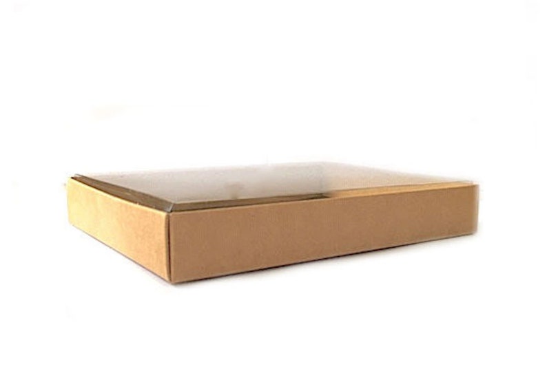 May include: A rectangular box with a clear lid and a brown base. The box is empty and sits on a white background. The box is likely used for packaging or storage.