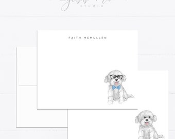 May include: White stationery set featuring the name FAITH MCMULLEN in black text. One card displays a watercolor illustration of a fluffy white dog wearing black glasses and a blue bow tie, while another card shows a similar dog without accessories.