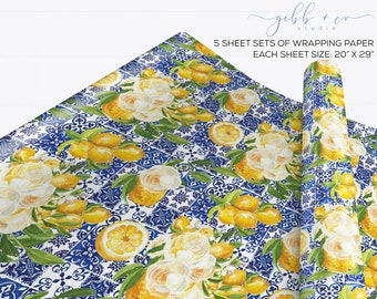 May include: Five sheets of wrapping paper with a lemon and floral design. The paper features a white background with blue and white tile patterns, yellow lemons, and white flowers. Each sheet measures 20 inches by 29 inches.