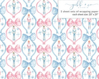 May include: A seamless pattern featuring a repeating design of blue and pink bows with a nutcracker in the center of each bow. The background is white with snowflakes.