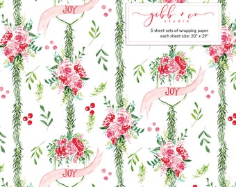 May include: Watercolor wrapping paper with a white background, featuring vertical green garland stripes. Pink floral bouquets and red berries are interspersed throughout. Pink banners with the word "JOY" are also present. The text in the image says "5 sheet sets of wrapping paper each sheet size: 20" x 29".