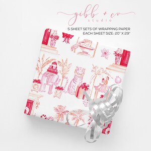 May include: A set of 5 sheets of wrapping paper featuring a pink and red pattern with elephants, tigers, palm trees, and gifts. Each sheet measures 20 inches by 29 inches.