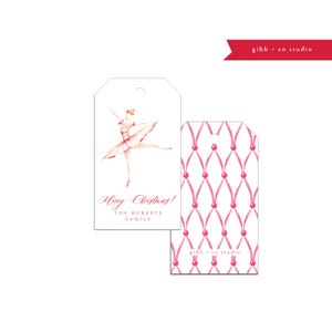 May include: Pink and white Christmas gift tags with a ballerina illustration and the text "Happy Christmas! The Roberts Family". The back of the tag features a pink and white ribbon pattern.