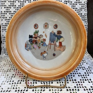 vintage baby dish orange luster with photographer and toys