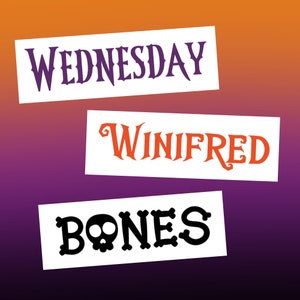 May include: Three white rectangular signs with black text. The top sign says "WEDNESDAY" in a gothic font. The middle sign says "WINIFRED" in a gothic font. The bottom sign says "BONES" in a gothic font with a skull and crossbones graphic.