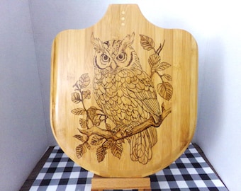 Owl with a Branch on Board