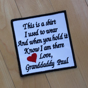 May include: White embroidered patch with a black border. The patch features a red heart and the text "This is a shirt I used to wear And when you hold it Know I am there Love, Granddaddy Paul".