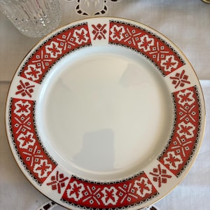 May include: A set of three ceramic mugs with a speckled, matte finish. Each mug features a different color: light blue, cream, and gray. The mugs have a simple, modern design with a rounded shape and a handle.