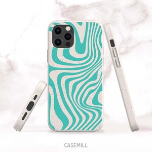 May include: A set of phone cases with a retro wavy design. The cases are off-white with a teal swirl pattern. One case is on the phone, and two others are displayed separately. The brand name, CASEMILL, is printed at the bottom.