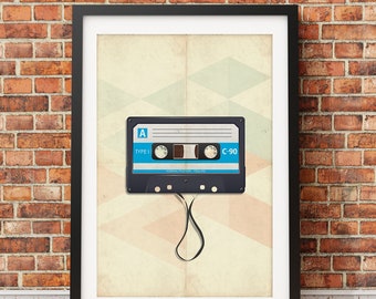 May include: A framed print of a vintage cassette tape with a blue and white label. The tape is labeled "Type I" and "C-90". The tape is hanging from a black string.