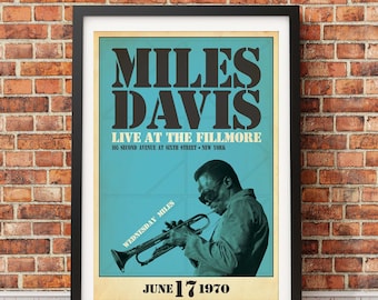 May include: A vintage poster advertising a Miles Davis concert at the Fillmore in New York City on June 17, 1970. The poster features a black and white photo of Miles Davis playing a trumpet, with the text "MILES DAVIS LIVE AT THE FILLMORE 105 SECOND AVENUE AT SIXTH STREET NEW YORK WEDNESDAY MILES JUNE 17 1970" in a retro font.