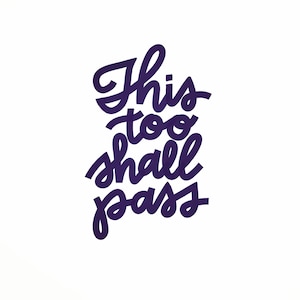 May include: Purple handwritten text on a white background that reads "This too shall pass."