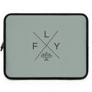 May include: A sage green laptop sleeve with a black zip and trim. The design features the word "FLY" in a cross formation with a small airplane graphic in the centre. The sleeve is rectangular and designed to protect a laptop.