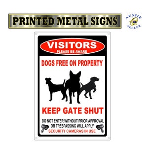 Dogs on property gate sign