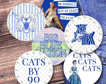 May include: A collection of round coasters with various designs and text. One coaster features a blue and white striped background with a wildcat illustration. Other coasters have phrases like "I'M A CAT" and "CATS BY 90".