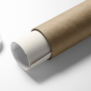May include: A rolled canvas print emerges from a brown cardboard tube, with a white plastic lid to the left. The canvas has a textured surface. The scene is set against a bright white background, creating a clean, minimalist aesthetic.