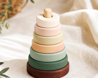 Toddlers name engraved wooden stacking toy with seven colourful rings