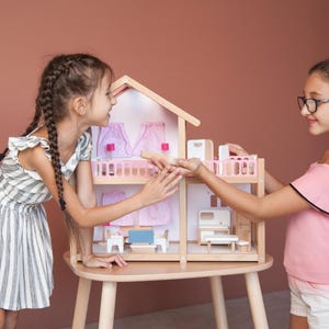 The set includes a dollhouse with furniture, dollhouse cottage, american girl doll house, assembled furnished dollhouse, finished dollhouse