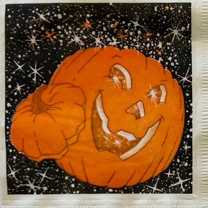 May include: A bright orange jack-o'-lantern with a wide, toothy grin against a black background with white stars.