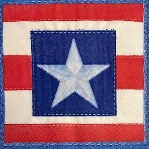 May include: A red, white, and blue American flag design with a white star in the center of a blue square.