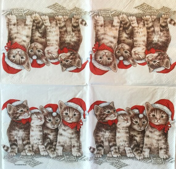 Made a holiday themed wrapping paper. Included 4 different cats, each  themed around a different holiday supported within december (Christmas,  Hannukah, Kwanzaa and Winter Solstice) Would love any feedback people  have!! 
