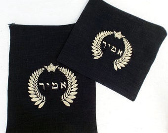May include: Two black fabric pouches with gold embroidery. The pouches feature a crown and the Hebrew word "מלך" (meaning "king") surrounded by a wreath of leaves.