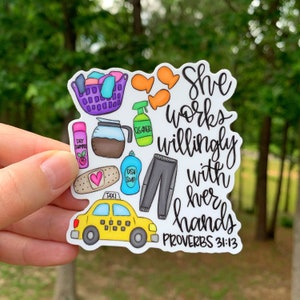 May include: A white sticker with colorful illustrations of household items and the text "She works willingly with her hands Proverbs 31:13".
