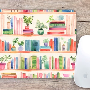 May include: A watercolor illustration of a bookshelf filled with colorful books and potted plants. The bookshelf is painted in a light pink and orange color scheme. The books are arranged in a random order, and the plants are all different types. The background is a light cream color.