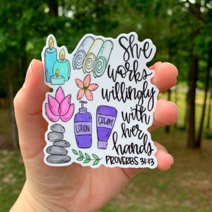 May include: A white sticker with a quote about working with your hands. The quote reads "She works willingly with her hands, Proverbs 31:13". The sticker is decorated with spa-themed illustrations, including candles, towels, lotion bottles, and flowers.