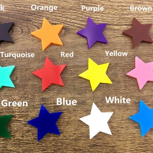 May include: A set of 12 star-shaped craft supplies in various colors, including black, orange, purple, brown, turquoise, red, yellow, pink, green, blue, white, and aqua.