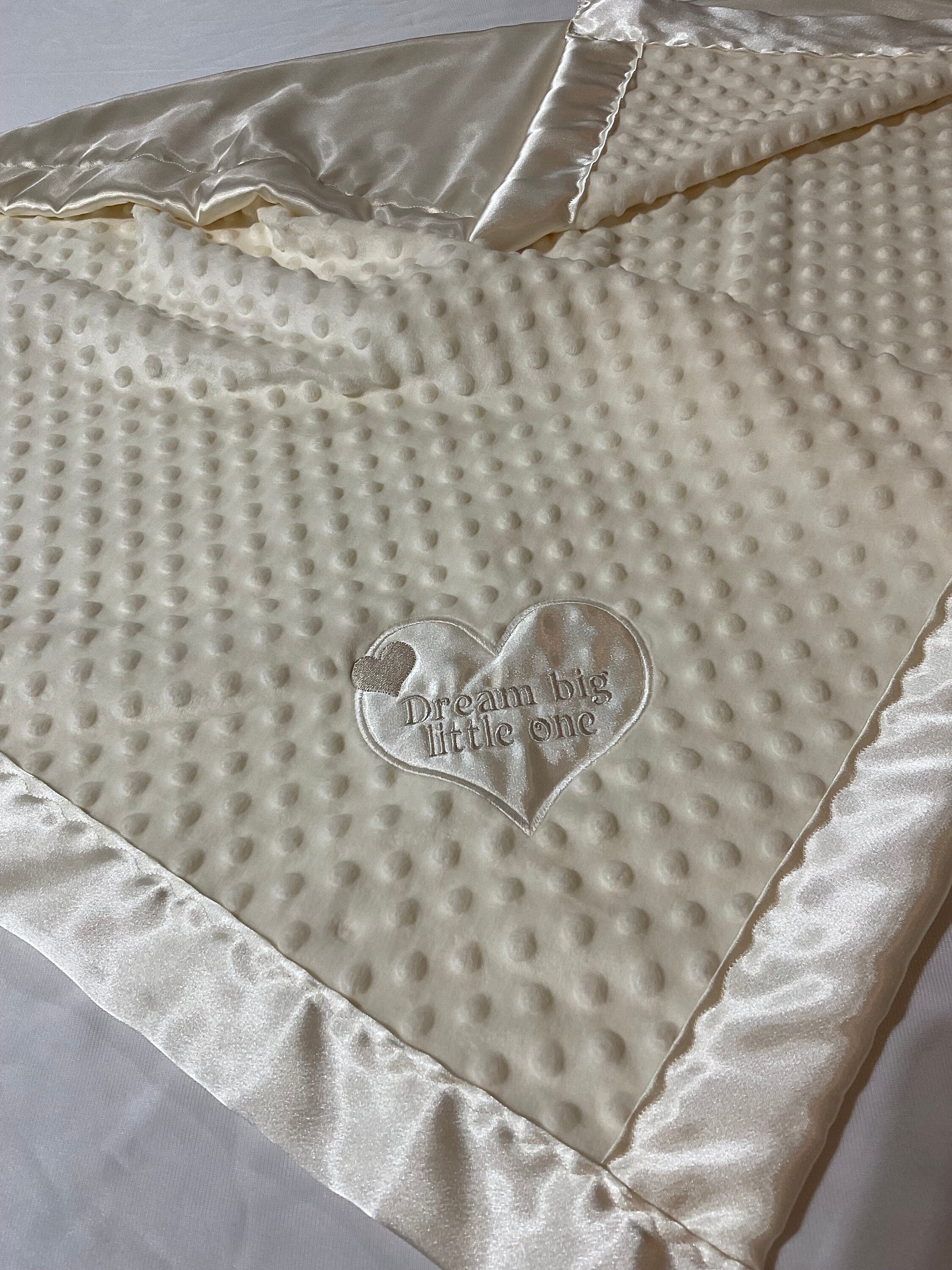 Baby Blanket Minky front backed and edged with silky fabric. Personalized with Dream big little one. This blanket measures 30x40