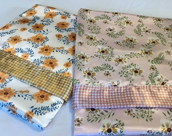 Floral Silky Baby Blanket, measures 30x40, floral silky front/backed and edged with coordinating silky