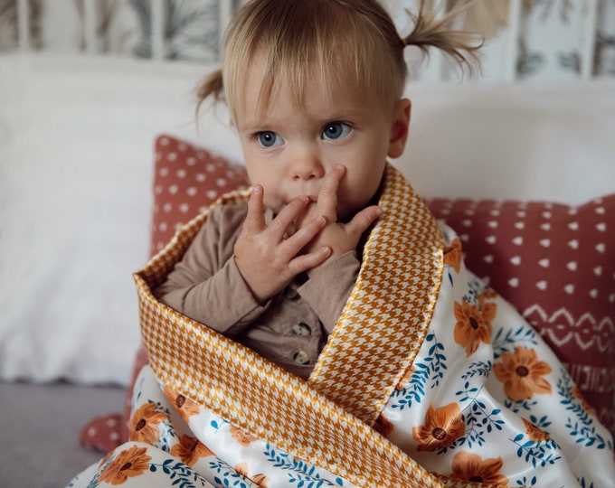 Floral Silky Baby Blanket, measures 30x40, floral silky front/backed and edged with coordinating silky