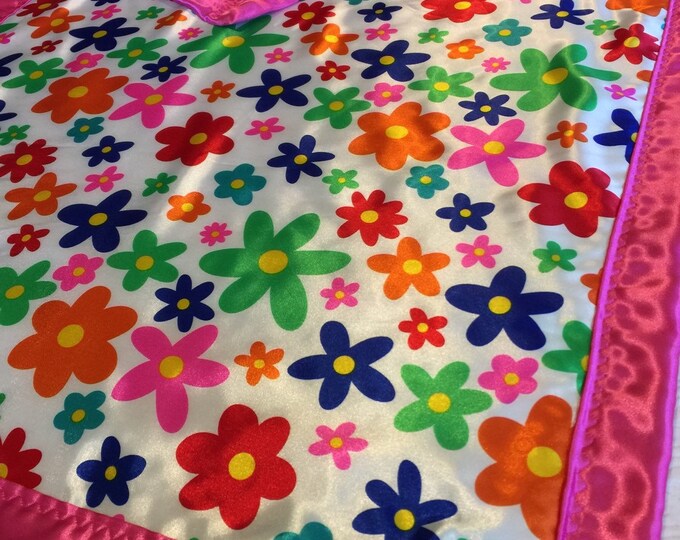 Adorable homemade floral silky baby blanket, measure 30x40, front backed and edged with cozy silky satin, sure to be a favorite.