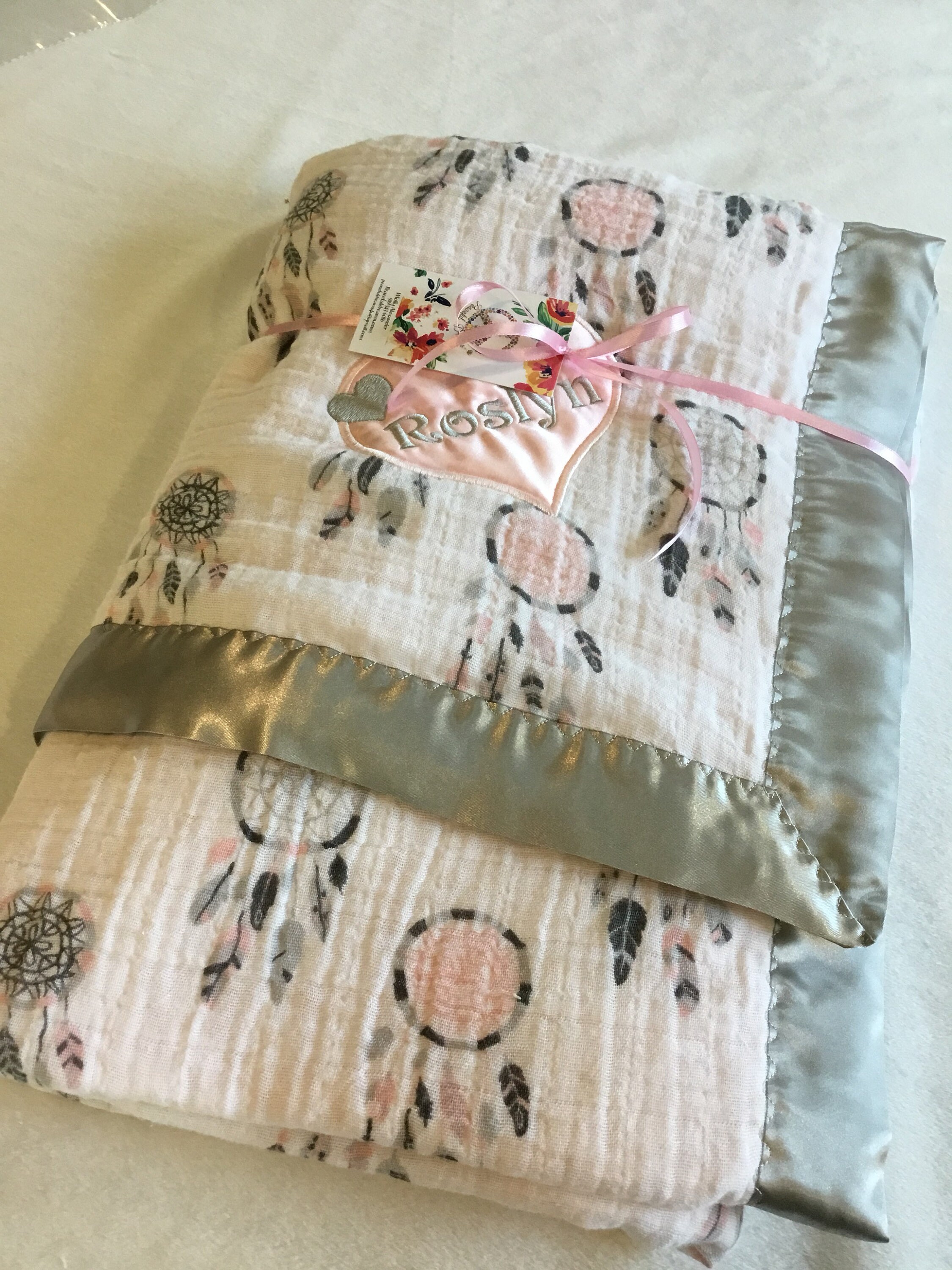 Dream Catcher Muslin Baby Blanket. Muslin front backed with pink cozy