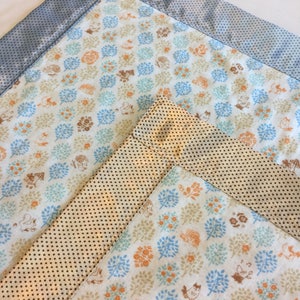 Woodland muslin lovey, muslin front~backed and edged with coordinating silky fabric. This lovey measures 20x20