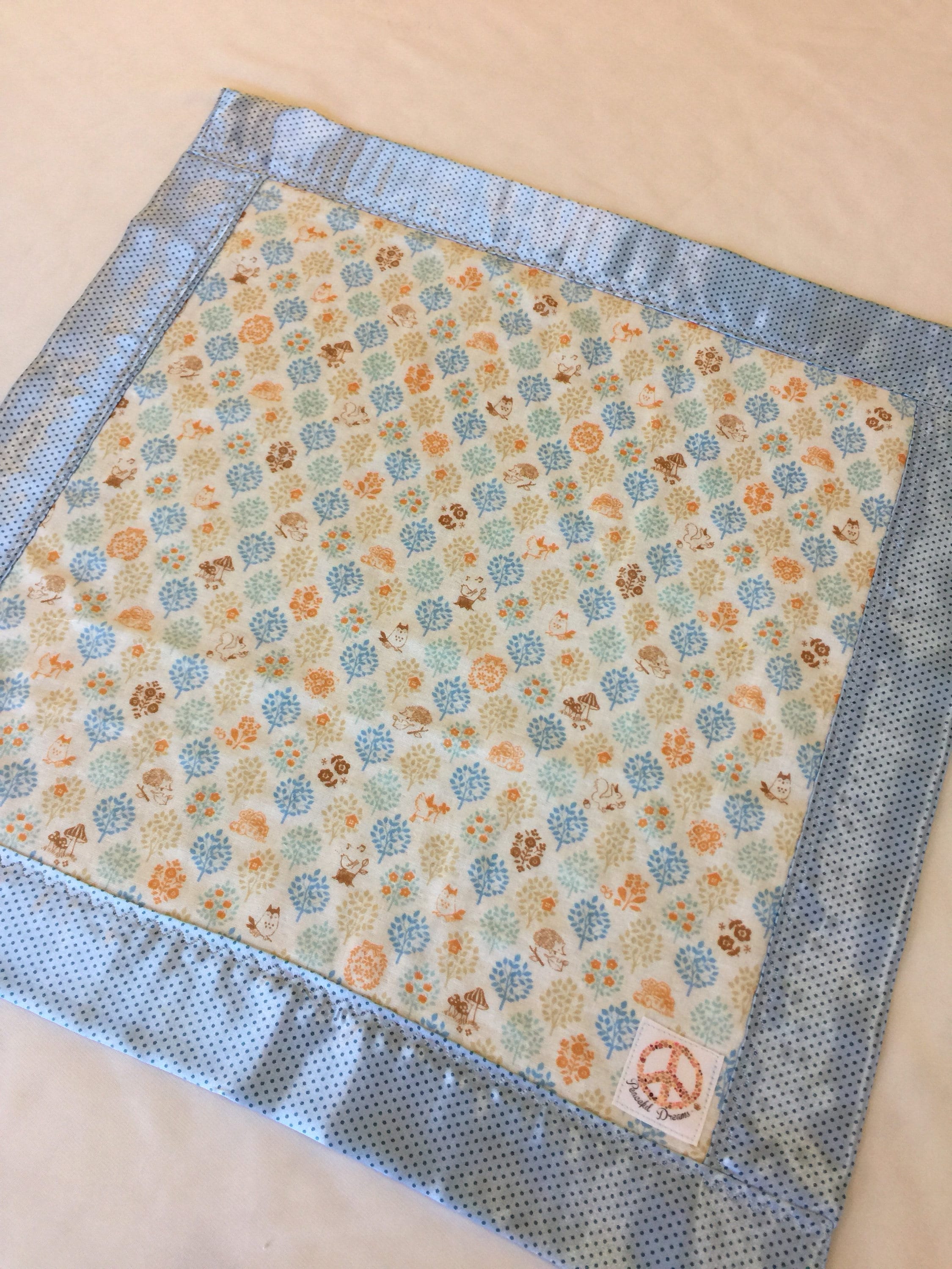 Woodland muslin lovey, muslin frontbacked and edged with coordinating silky fabric. This lovey